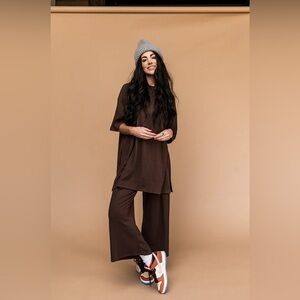 Dressed in Lala Lex Ribbed Playsuit in Mocha